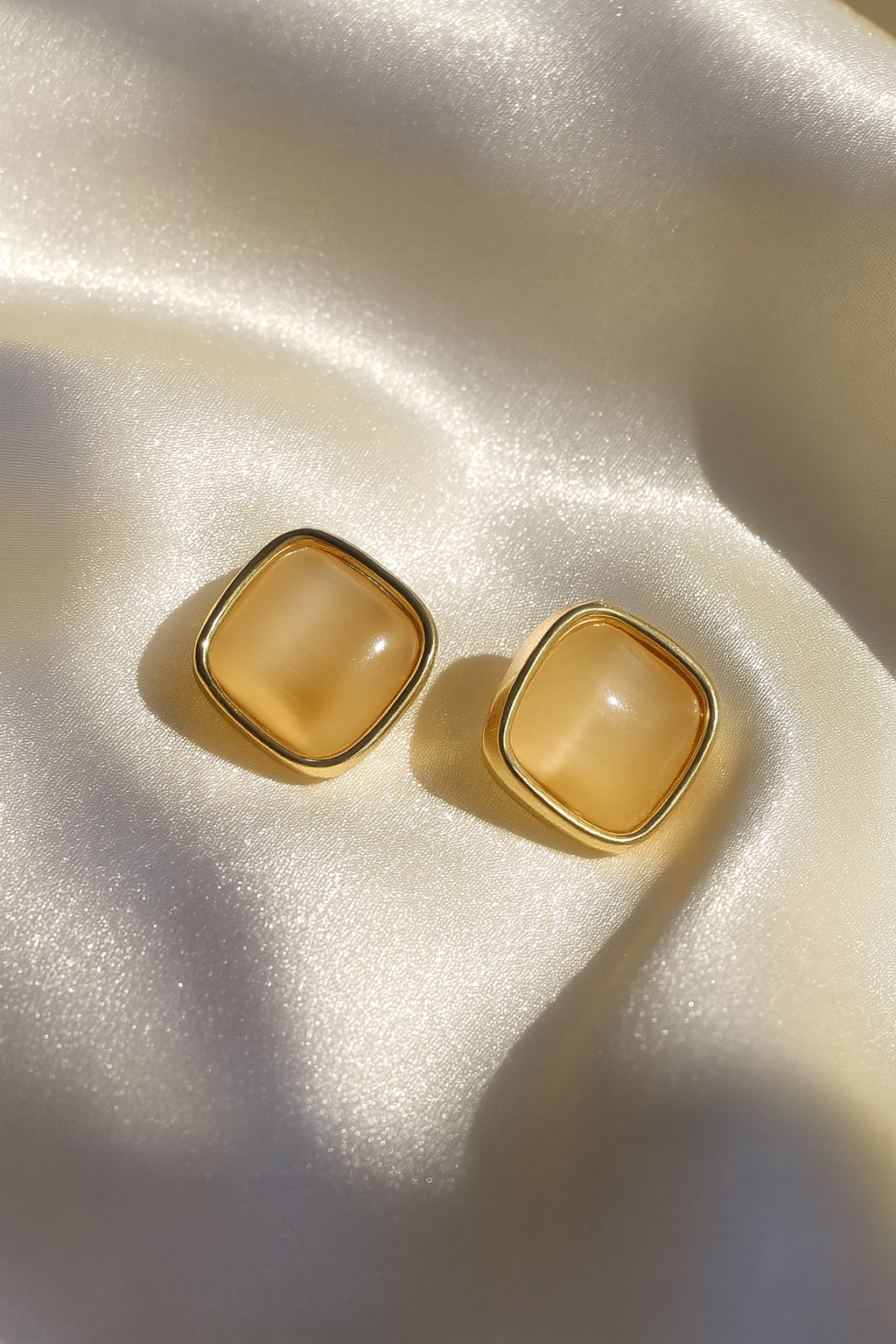 Jewello fancy gold plated square design and light pink stone stud anti tarnish Korean earring for women and girls.