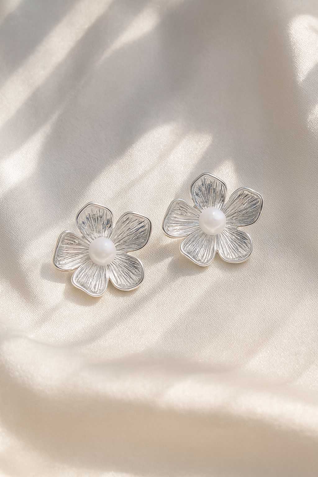 Jewello trendy silver-plated floral design and white pearl stud anti tarnish dainty Korean earring for women and girls.