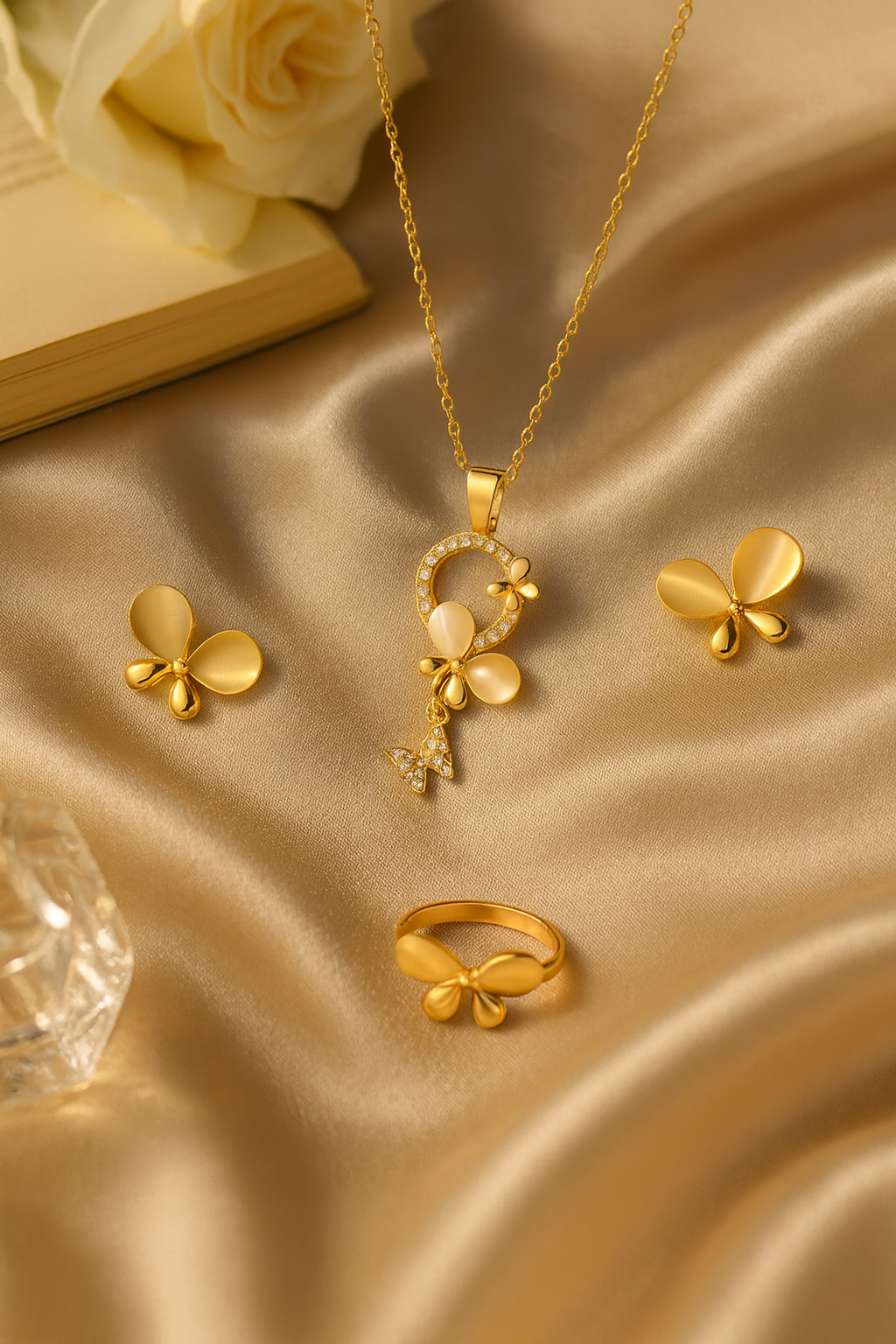 Jewello gold plated floral design with white stone stud chain pendant set for women and girls.