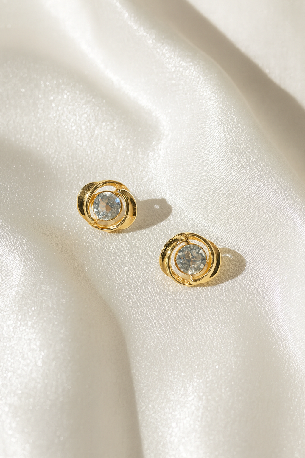 Jewello gorgeous gold plated and shimmering white stone stud anti tarnish Korean earring for women and girls.