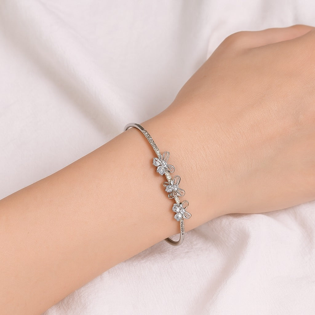 Jewello trendy silver-plated butterfly design with shimmering white stone stud cuff bracelet, Kada bracelet for women and girls.