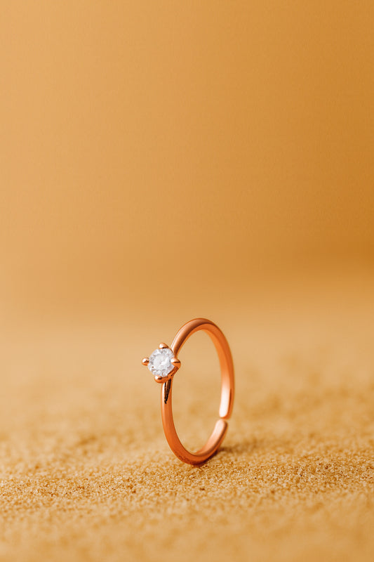 Jewello delicate rose gold plated and studded shimmering white stone Adjustable finger ring for women and girls.