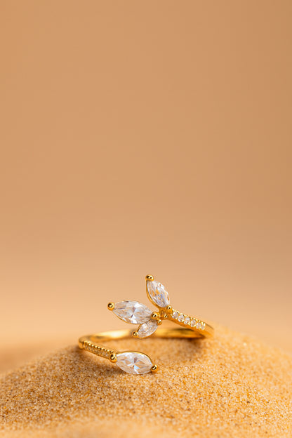 Jewello beautifully gold pated floral design and studded shimmiring American diamond Adjustable finger ring for women and girls.