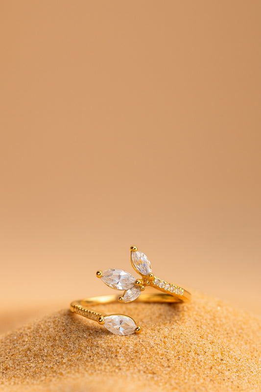 Jewello beautifully gold pated floral design and studded shimmiring American diamond Adjustable finger ring for women and girls.