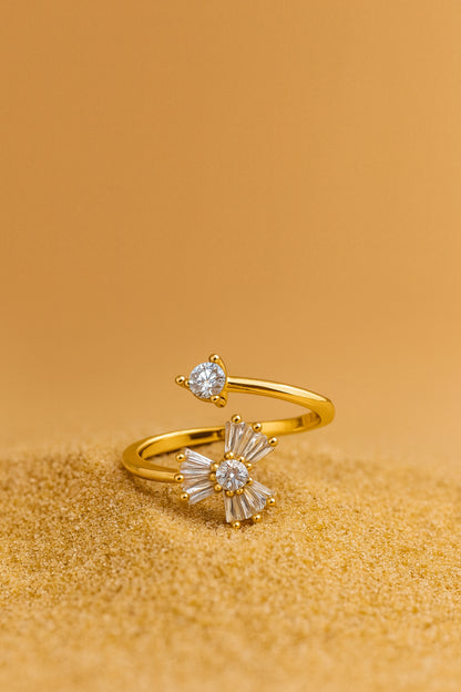 Jewello elegant gold-plated floral design and studded shimmiring white stone Adjustable finger ring for women and girls.