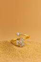 Jewello elegant gold-plated floral design and studded shimmiring white stone Adjustable finger ring for women and girls.