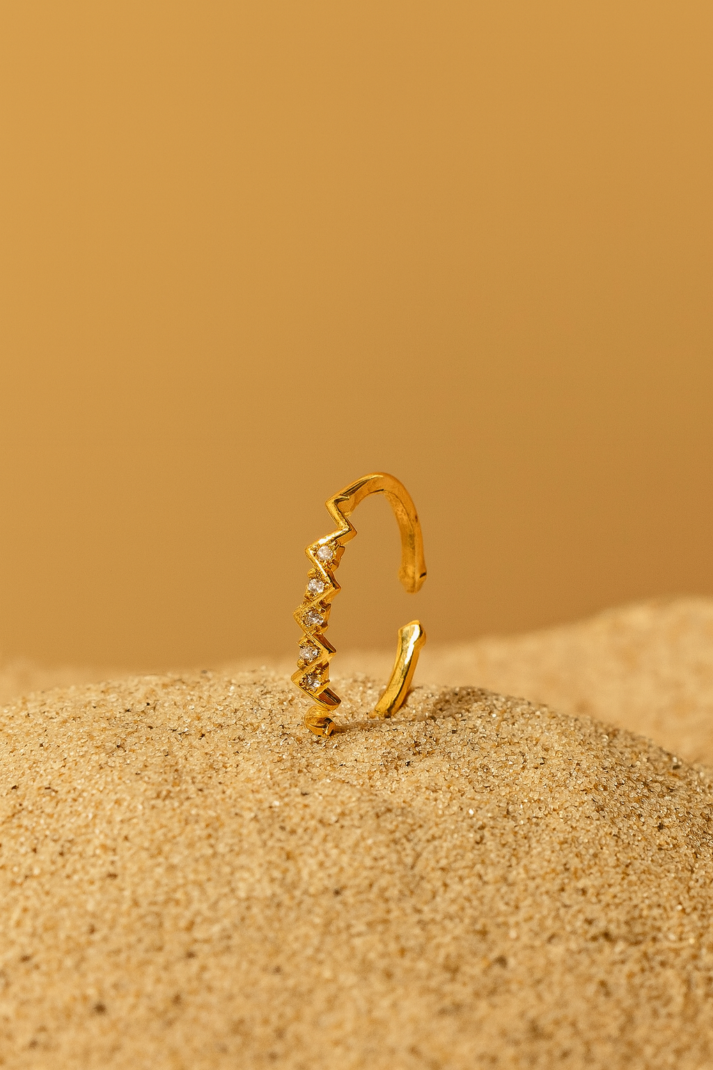 Jewello shimmering zig-zag gold plated with a studded American diamond Adjustable finger ring for women and girls.