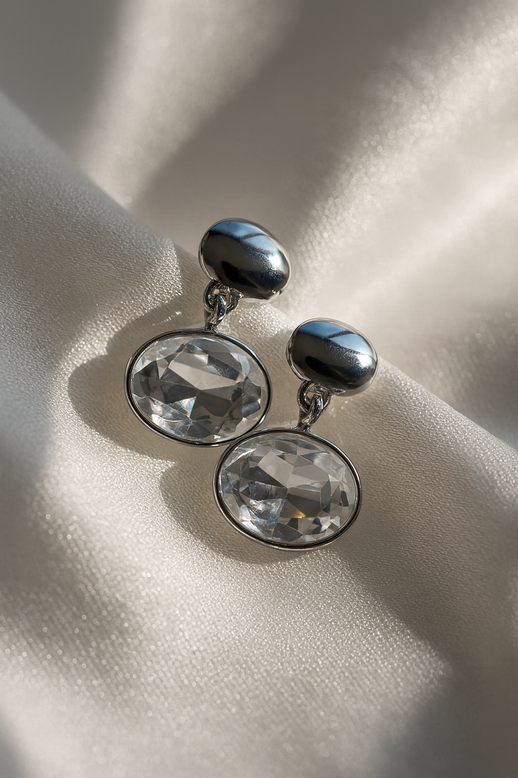 Jewello fancy silver plated oval shape design white shimmering stone stud Korean earring for women and girls.