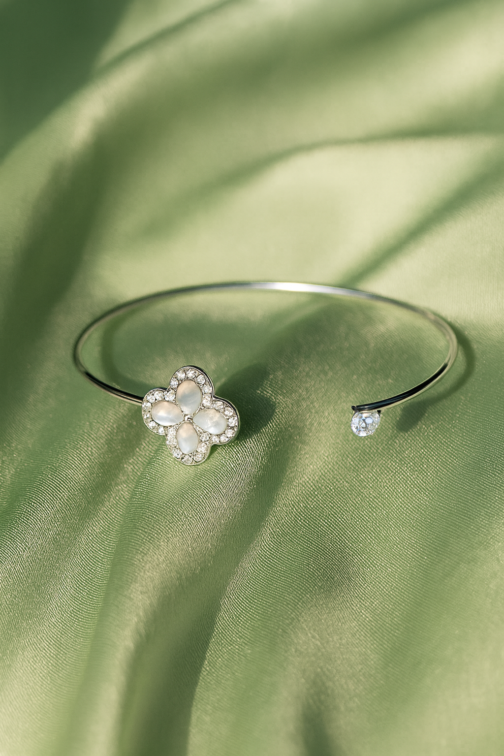 Jewello fashionable silver-plated flora design with shimmering white stone stud cuff bracelet, Kada bracelet for women and girls.