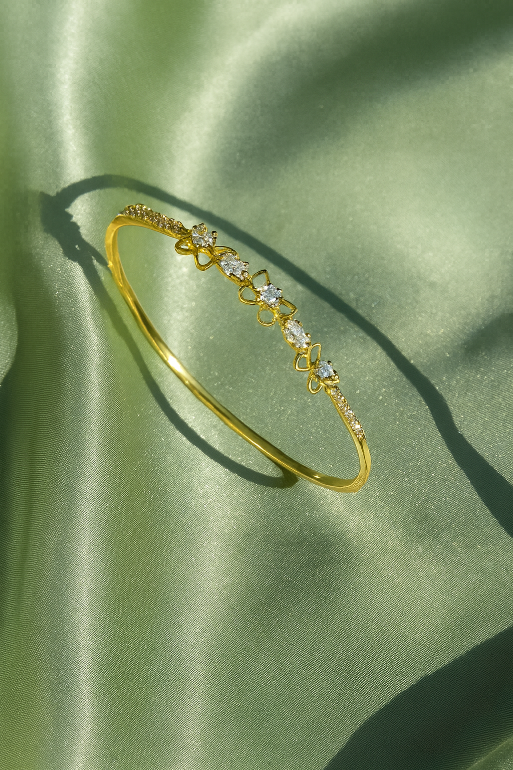 Jewello delicate gold plated with shimmering white stone stud cuff bracelet, Kada bracelet for women and girls.
