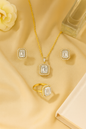 Jewello elegant gold plated with shimmering white stone stud chain pendant, set for women and girls.
