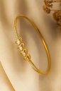 Jewello delicate gold plated with shimmering white stone stud Adjustable Kada bracelet for women and girls.