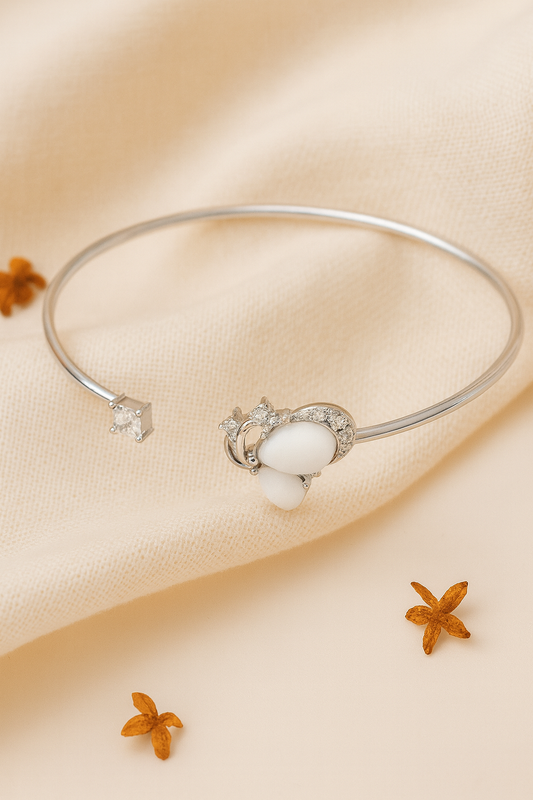 Jewello fancy silver-plated floral design with shimmering white stone stud Adjustable cuff bracelet, Kada bracelet for women and girls.