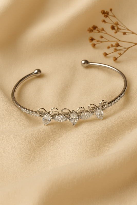Jewello trendy silver-plated butterfly design with shimmering white stone stud cuff bracelet, Kada bracelet for women and girls.