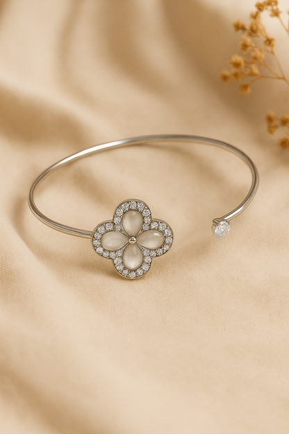 Jewello fashionable silver-plated flora design with shimmering white stone stud cuff bracelet, Kada bracelet for women and girls.
