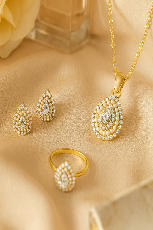 Jewello Adorable gold-plated drop shape with shimmering stone and pearl stud chain pendant, earring and finger ring set for women and girls.