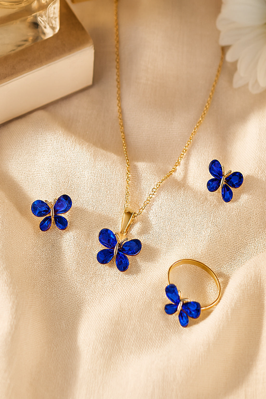 Jewello adorable gold-plated butterfly design with shimmering blue stone stud chain pendant, set for women and girls.