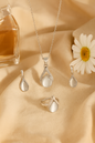 Jewello fashionable silver-plated drop design with white stone stud chain pendant set for women and girls.