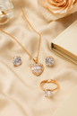 Jewello stylish rose gold-plated heart design with shimmering white stone stud pendant chain set for women and girls.
