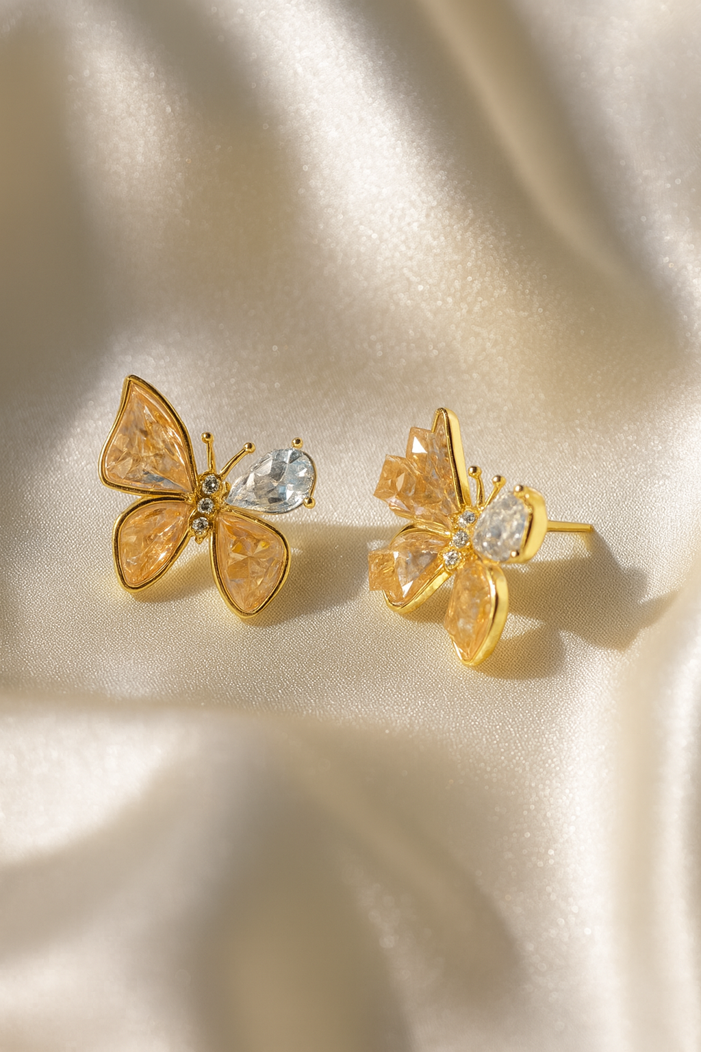 Jewello fashionable gold-plated butterfly design and studded orange stone anti tarnish Korean earring for women and girls.