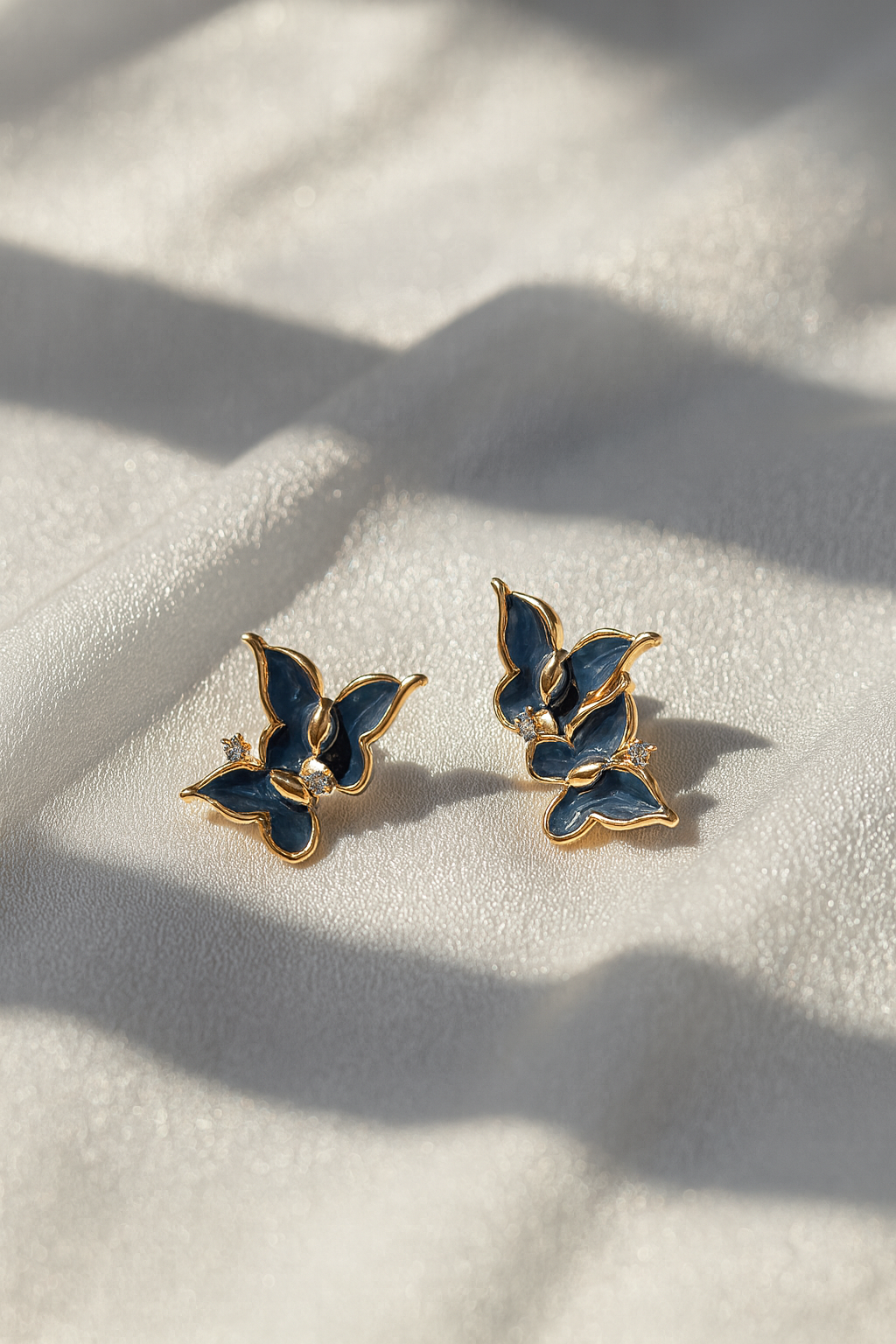 Jewello amazing gold-plated butterfly design with black stone stud dainty korean earring for women and girls. Gift for her.
